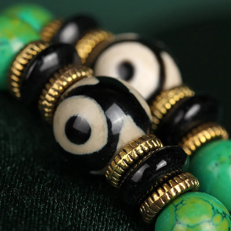 Natural turquoise bracelet with 108 round 8mm beads on a white background.