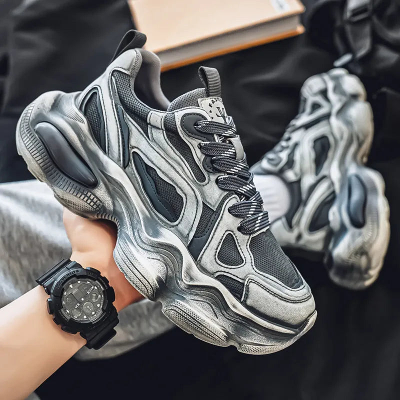 Men's black and grey mesh platform sneakers with a round toe and lace-up front on a rubber sole.