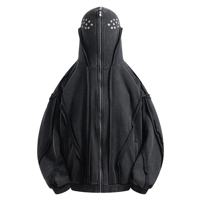 Black loose-fit zip-up hooded coat with an abstract pattern and padding worn as an autumn layer.