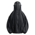Black loose-fit zip-up hooded coat with an abstract pattern and padding worn as an autumn layer.