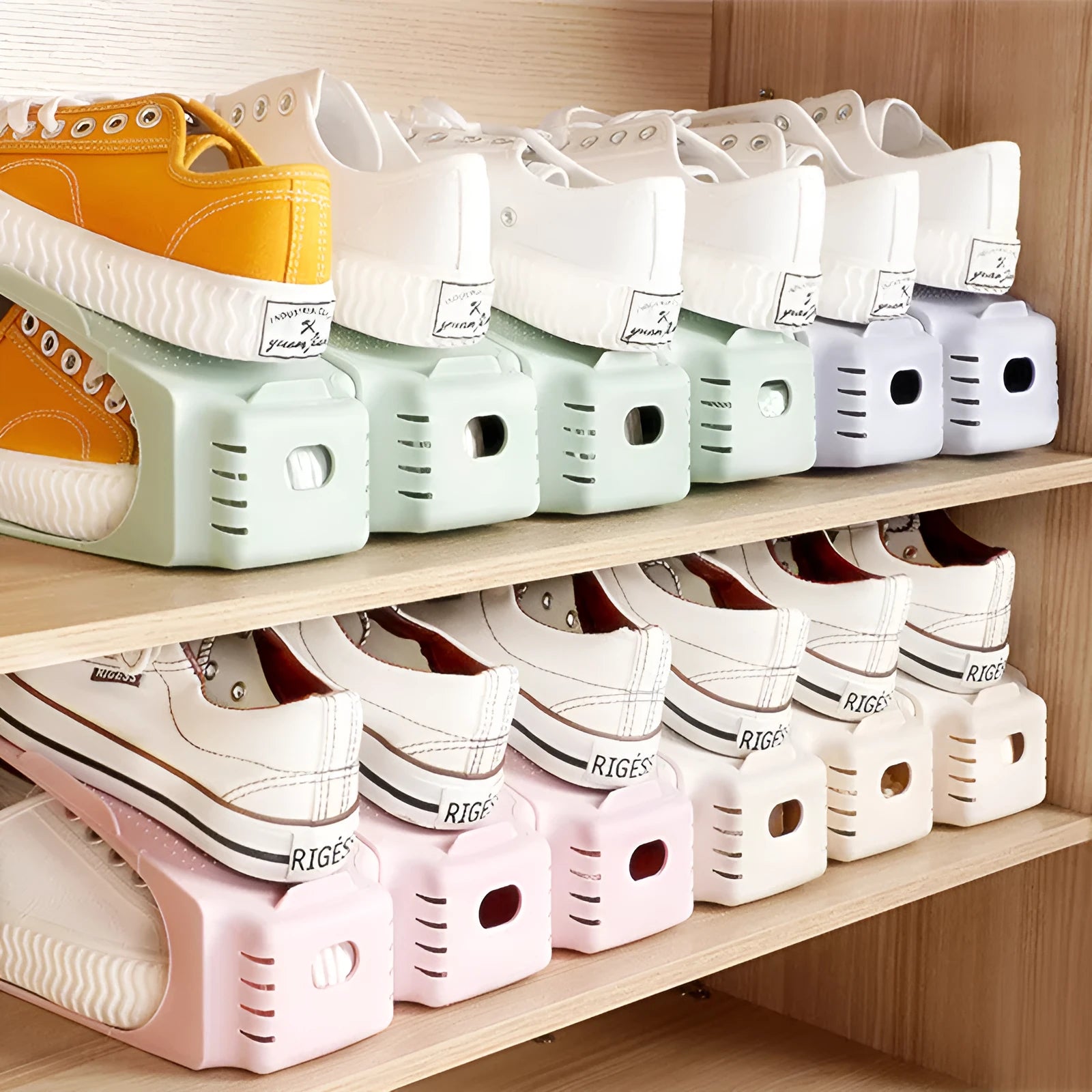 Stackable plastic double shoe shelf cabinets in black, showing multiple units stacked with shoes on adjustable shelves