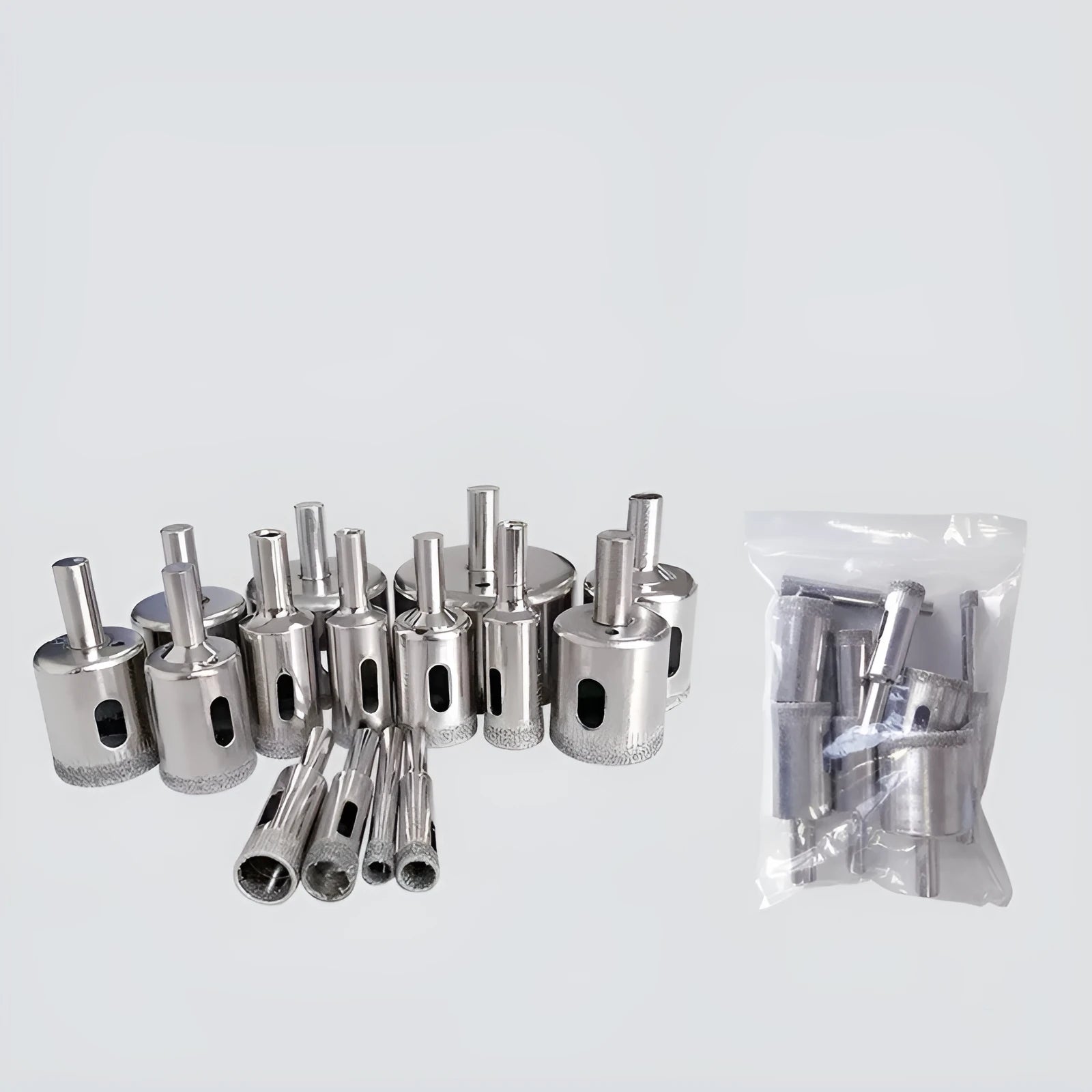 Electroplated tile rock plate drill bit set with one-piece steel construction on a work surface