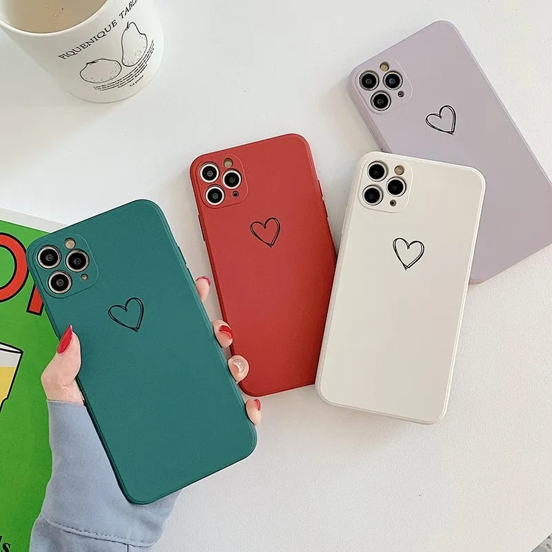 A solid colour silicone phone case for Apple iPhone on a table, showing its slim TPU back cover design.