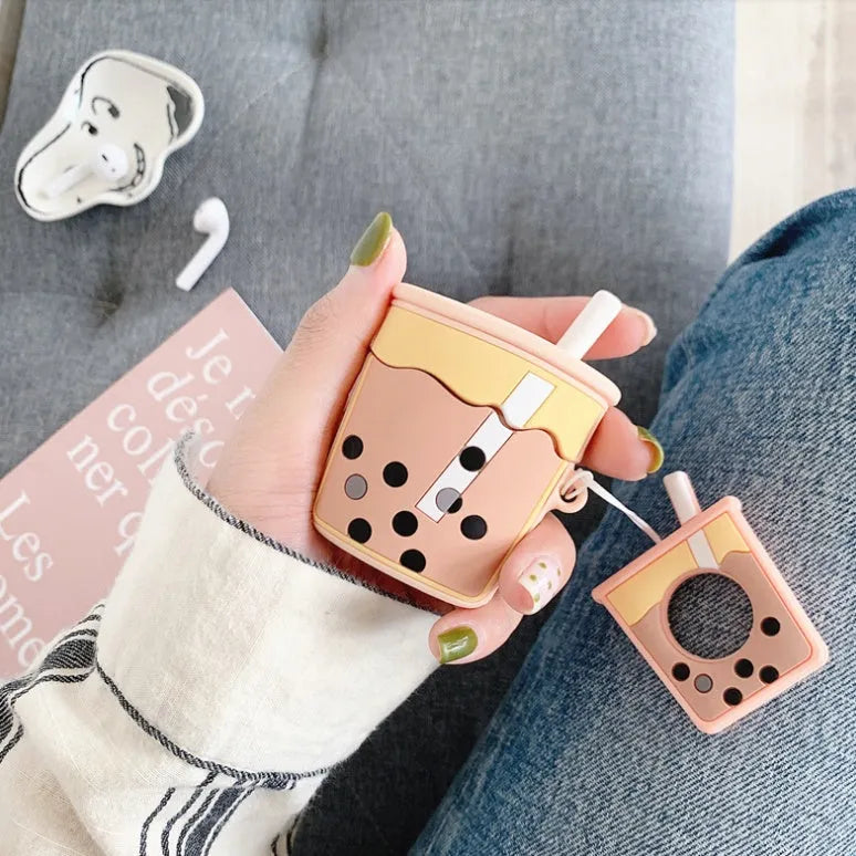 Silicone protector case for Apple AirPods 2nd generation in pink, orange, green and purple colours.