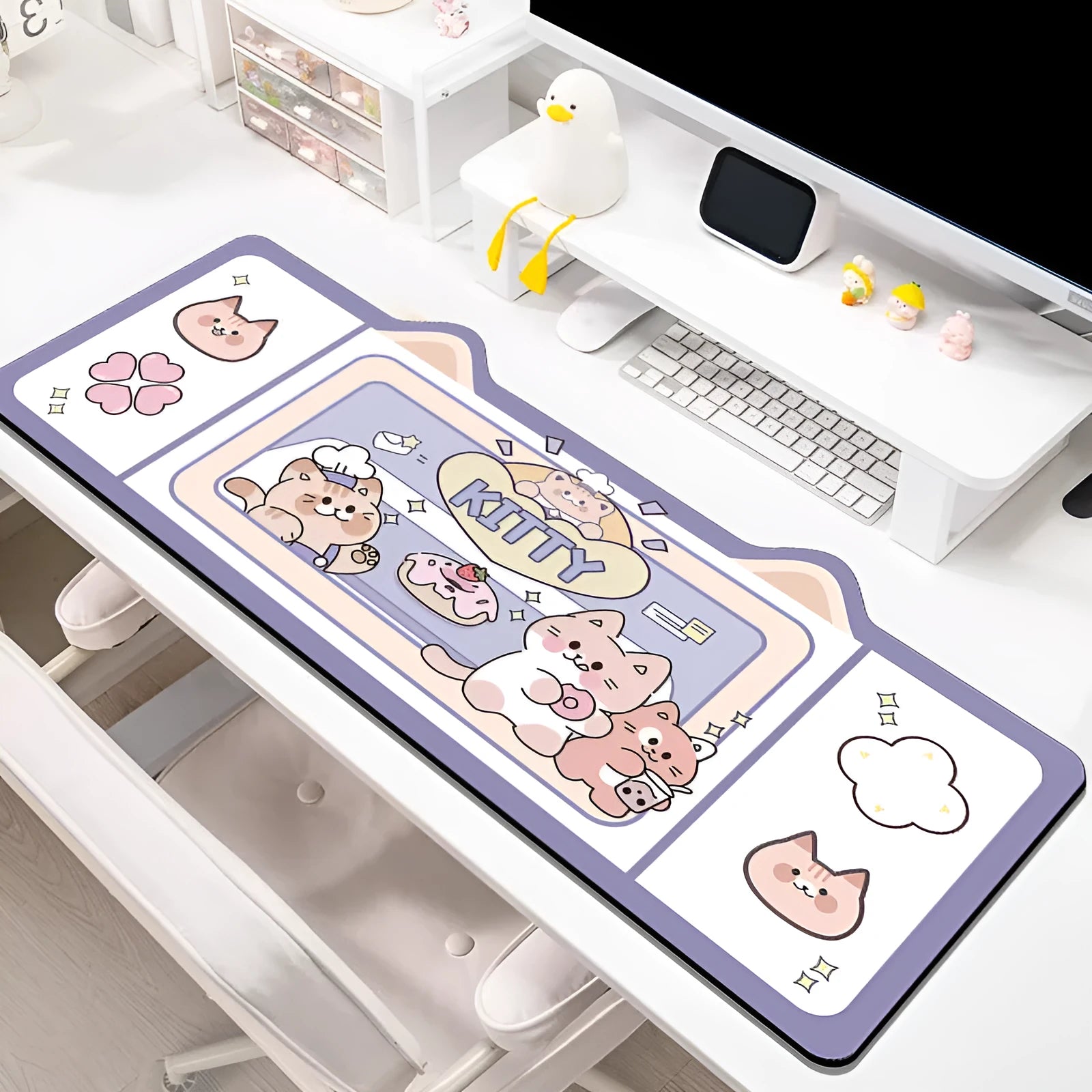 Natural rubber oversized desk pad showing pink bunny, purple bear, and purple kitten colour options