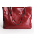 Horizontal body handbag made of two layer cowhide leather with wax finish, featuring dual main compartments and mobile phone pocket, size 30x37x13cm