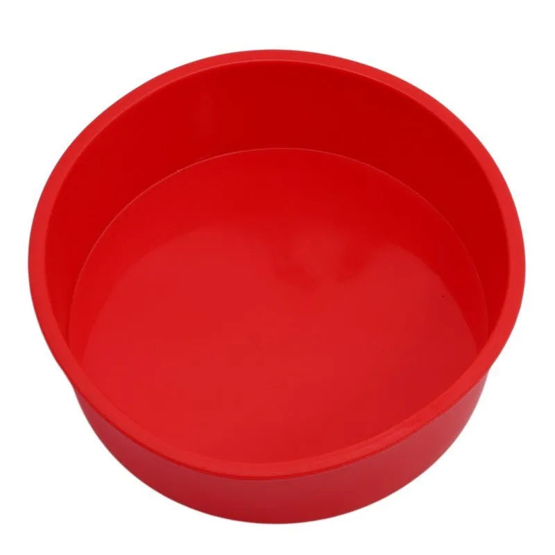 Set of three red round silicone cake baking moulds in 4-inch, 6-inch, and 8-inch sizes.