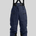 Man wearing black waterproof ski pants with adjustable ankle straps.