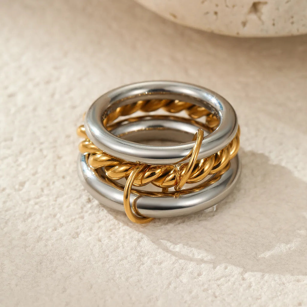 Stacked colour matching stainless steel ring with 18K gold plating, exaggerated design