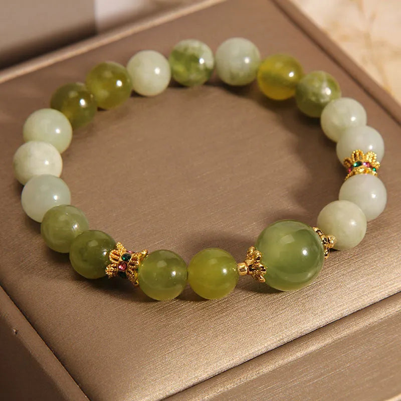 Xiuyan jade green mori-style women's bracelet with original design on a white background.