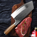 Stainless steel kitchen knife with a 320mm forged blade on a kitchen counter.