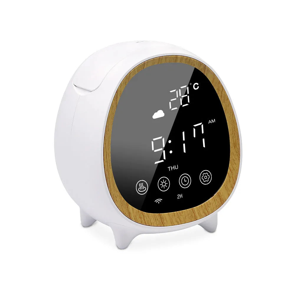 Round black smart WiFi aroma diffuser on a table with a fine cool mist rising from its top
