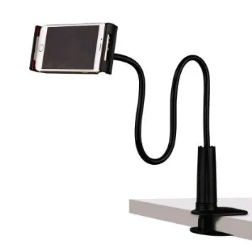 Black aluminium alloy bedside phone handset with a long arm and wide clamp, holding a mobile phone above a bed.