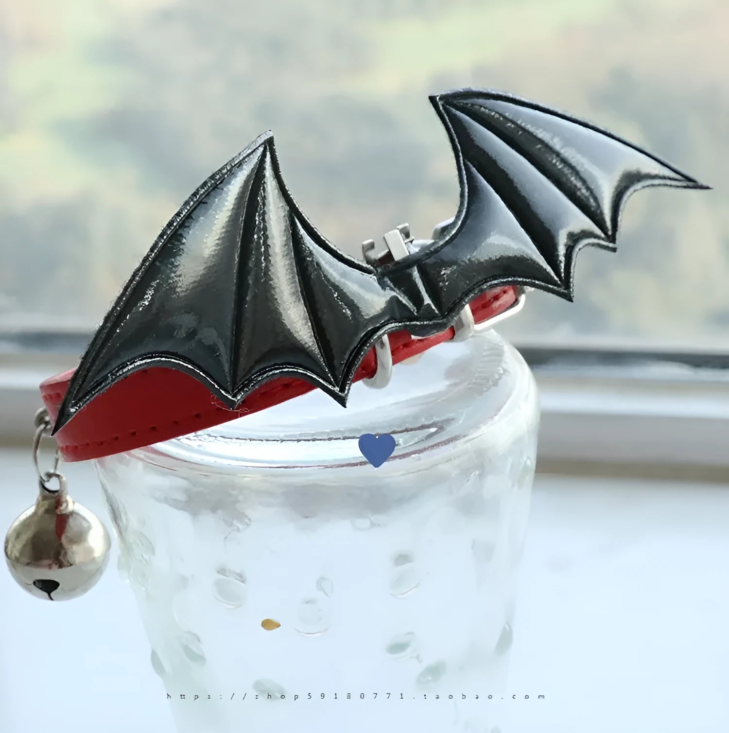 Leather dog collar with split devil wings design and bell attachment in patent leather satin material