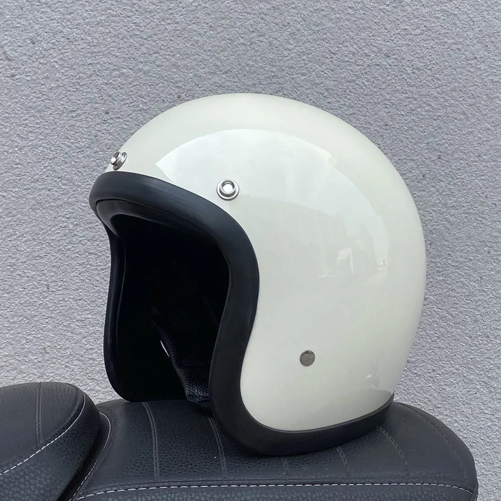 Retro-style motorcycle half helmet in cement grey with a glossy fibreglass shell on a plain background.