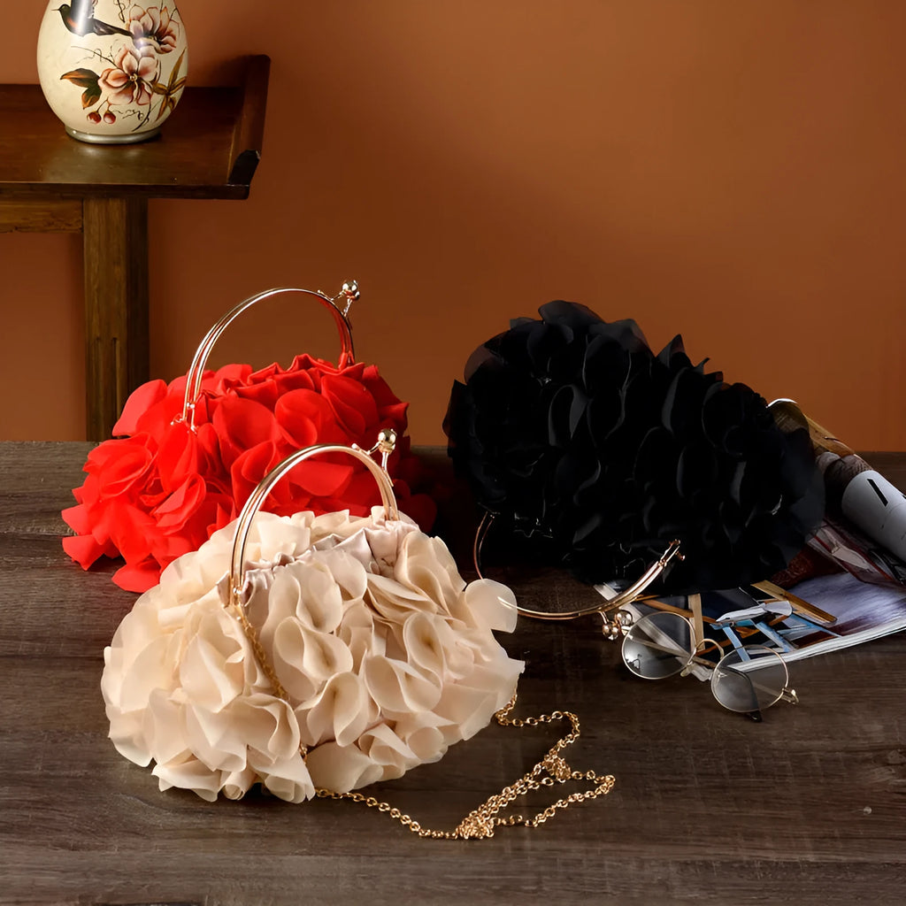 Handheld ladies' polyester banquet bag in soft dumpling shape with flower detail, black colour