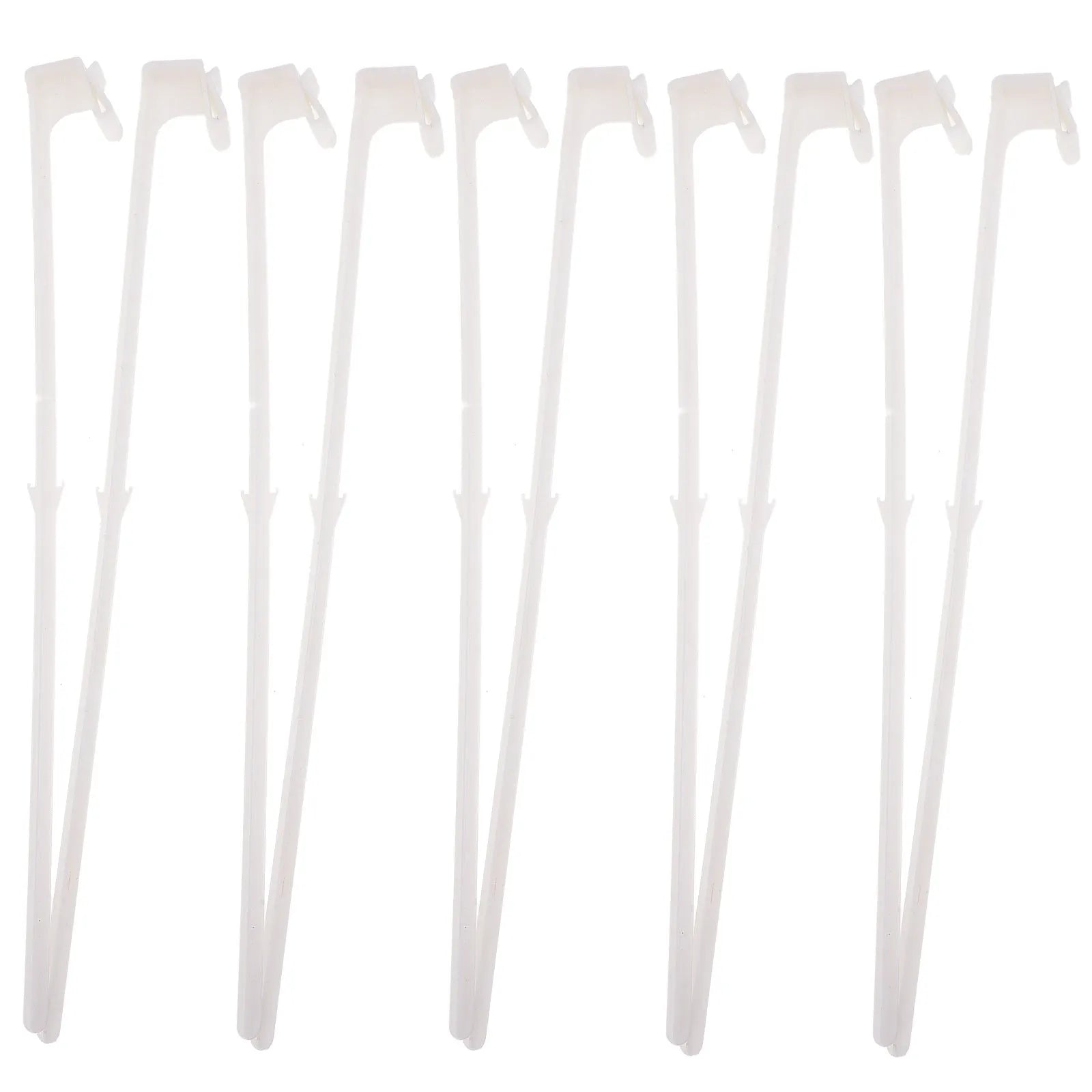 Ten white plastic car window flag pole holder clips laid out on a surface.