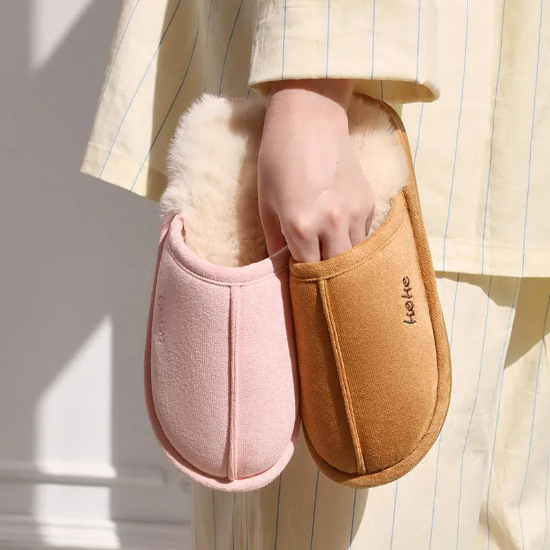 Pair of warm plush cotton slippers with TPR sole in beige on a tiled floor