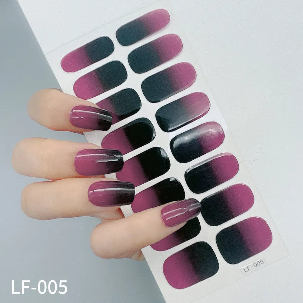 16 solid colour full nail art stickers with 22 patterns including cross, rose, butterfly designs in 12x6mm oval size