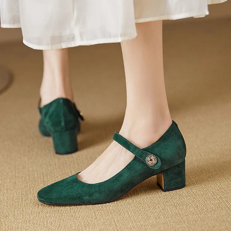 Women's black suede Mary Jane shoes with a square toe and chunky heel on a white background.