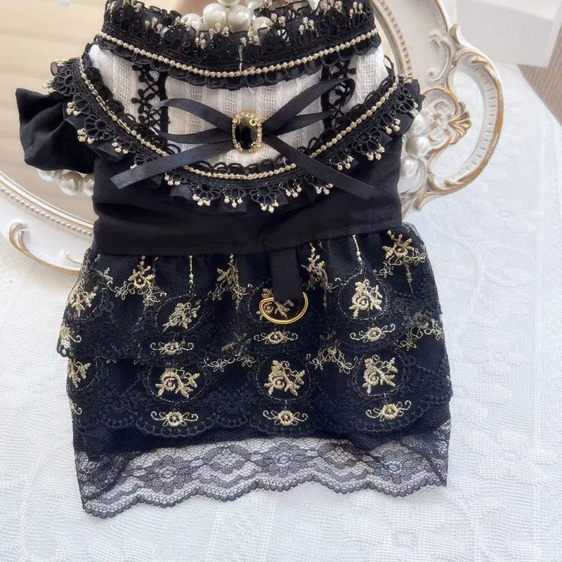 Golden tiered gothic-style skirt for a small dog on a mannequin, showing princess design.