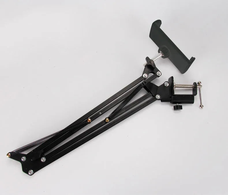 Adjustable black phone tablet stand on desktop holding mobile device at viewing angle