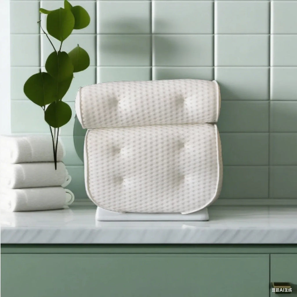 White adult bathtub pillow with 4D mesh material and suction cups on a bath mat.