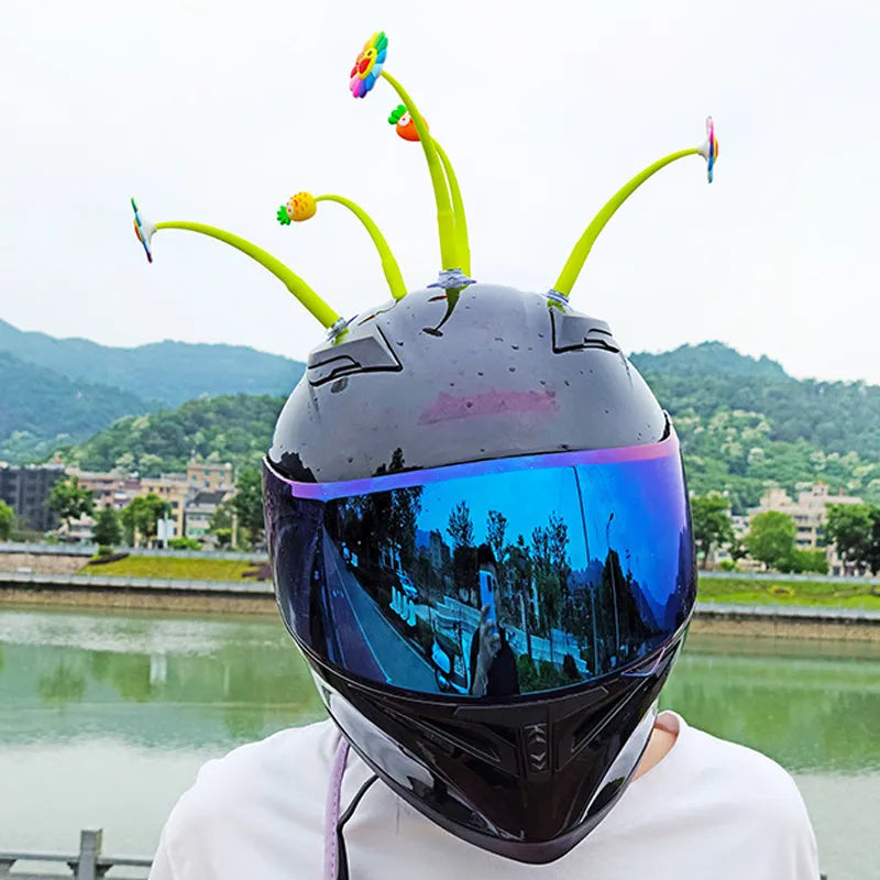 Yellow silicone sunflower decoration with a suction cup base for helmet mounting.