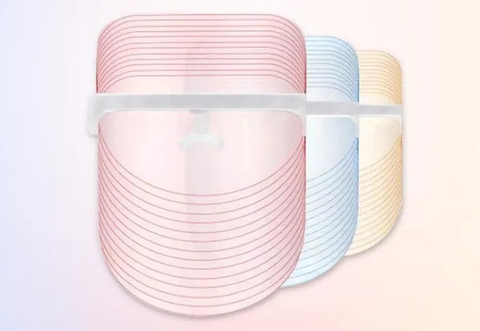 Transparent ABS LED light therapy face mask with red, yellow, and blue lights for home skin care