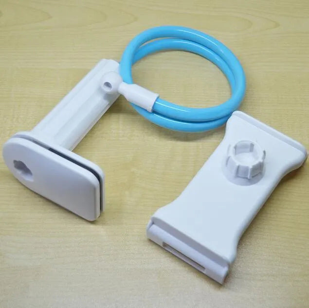 Black aluminium alloy bedside phone handset with a long arm and wide clamp, holding a mobile phone above a bed.