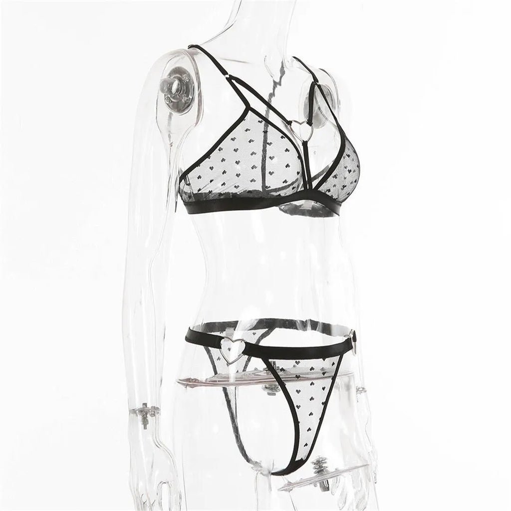 Women's black mesh and spandex two-piece set showing top and pants on a hanger.