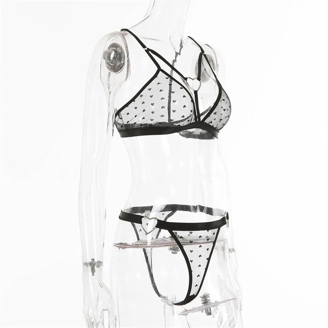 Women's black mesh and spandex two-piece set showing top and pants on a hanger.