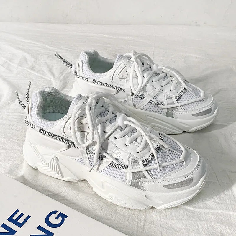 Men's white Korean style platform dad shoes with lace-up front on a neutral background.