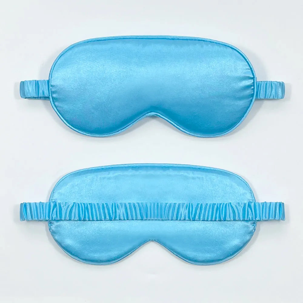 Rayon satin double-sided sleep mask in a selection of solid colours on a white background.