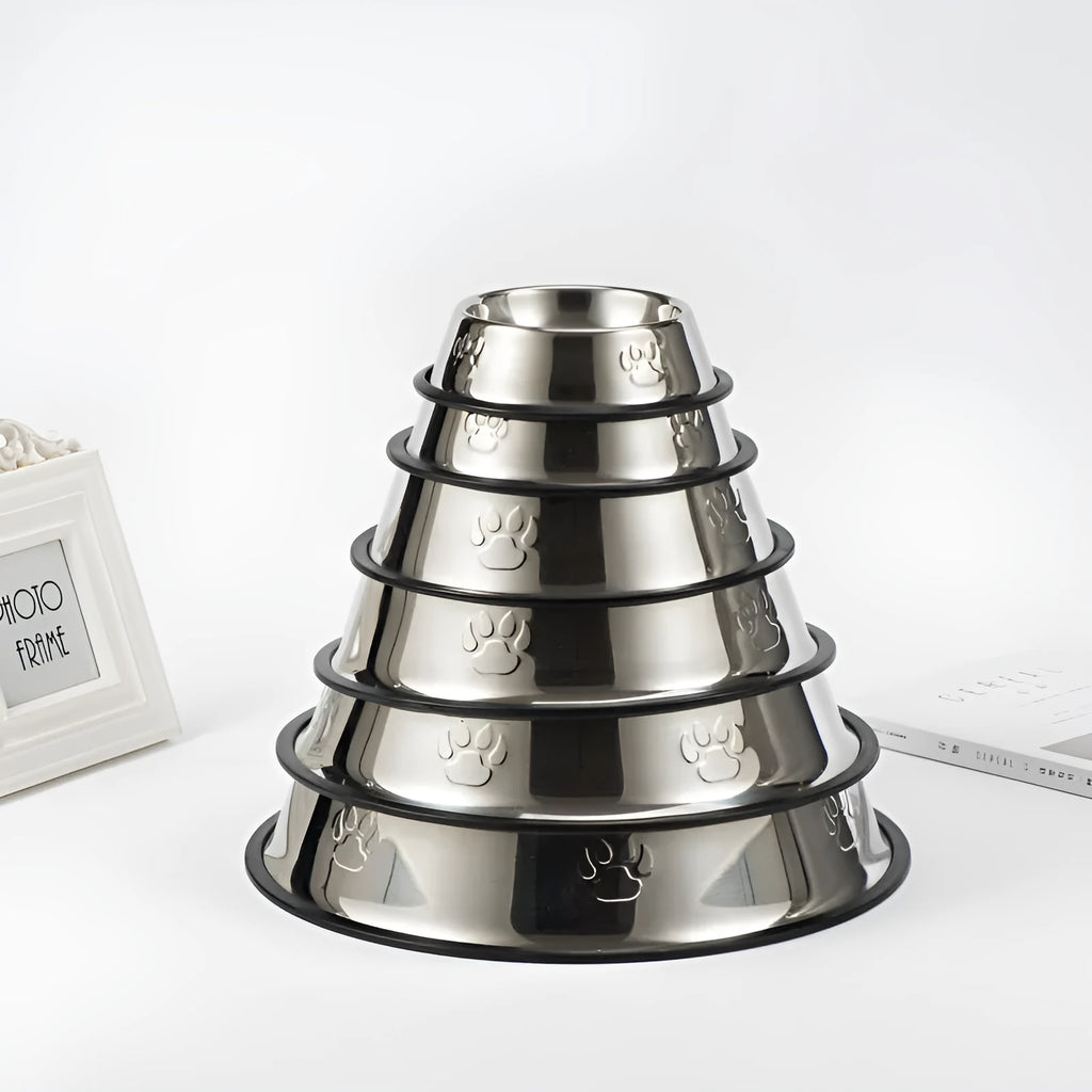 Stainless steel dog bowl with footprint pattern, available in sizes from 15cm to 34cm diameter
