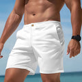 Man wearing grey straight-leg casual cotton blend sports shorts on a neutral background.