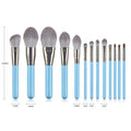 Blue 13-piece synthetic hair makeup brush set with wooden handles and aluminum ferrules on a clean surface