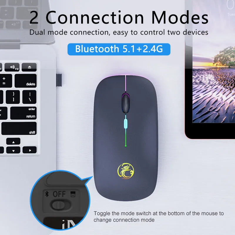 White luminous wireless mouse with glowing blue scroll wheel on a wooden desk