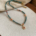 Freshwater pearl necklace with blue sun stone pendant on an adjustable clavicle chain.