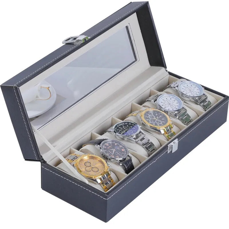 Grey leather watch storage box with a transparent dust cover, showing internal watch slots.