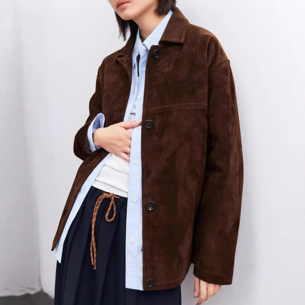 Yellow brown loose-fit cashmere coat with a leather-stitched Peter Pan collar and an attached waist belt.