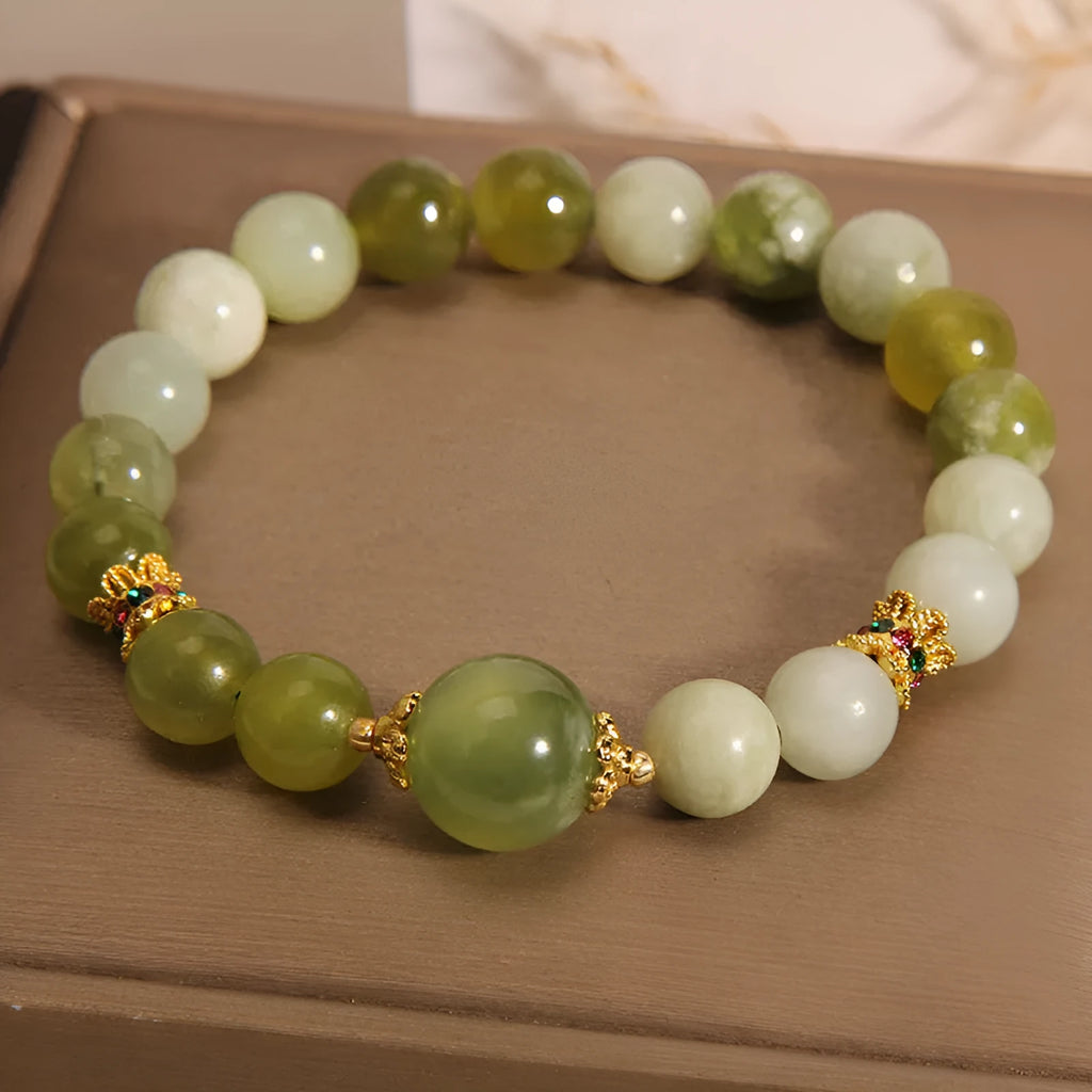 Xiuyan jade green mori-style women's bracelet with original design on a white background.
