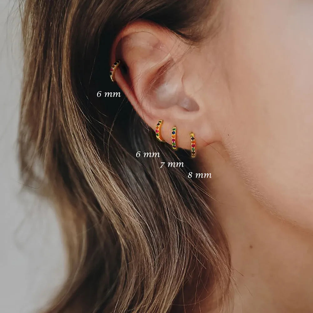 Circle zircon perforated stud earrings in gold, rose gold, and silver colours showing different size options