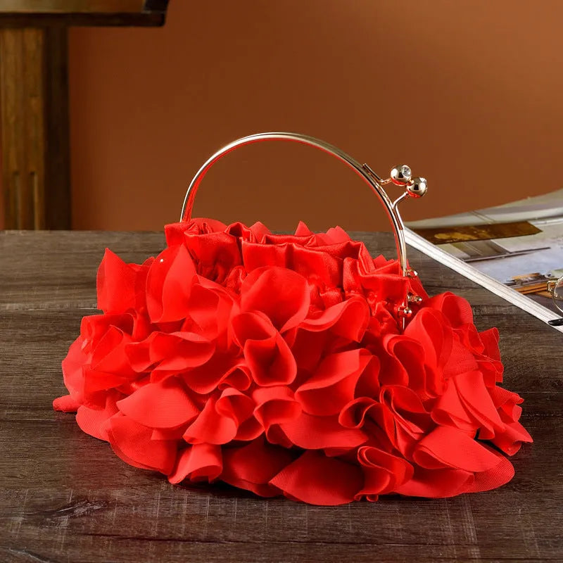 Handheld ladies' polyester banquet bag in soft dumpling shape with flower detail, black colour