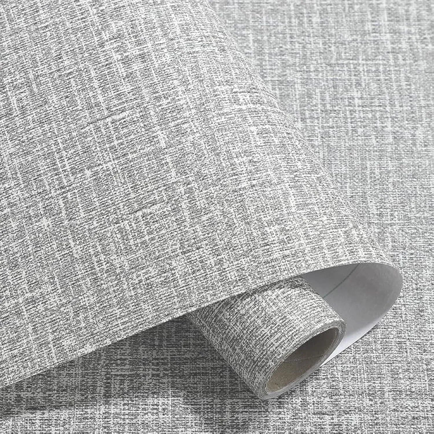 Roll of gray linen self-adhesive wallpaper with textured double-layer surface