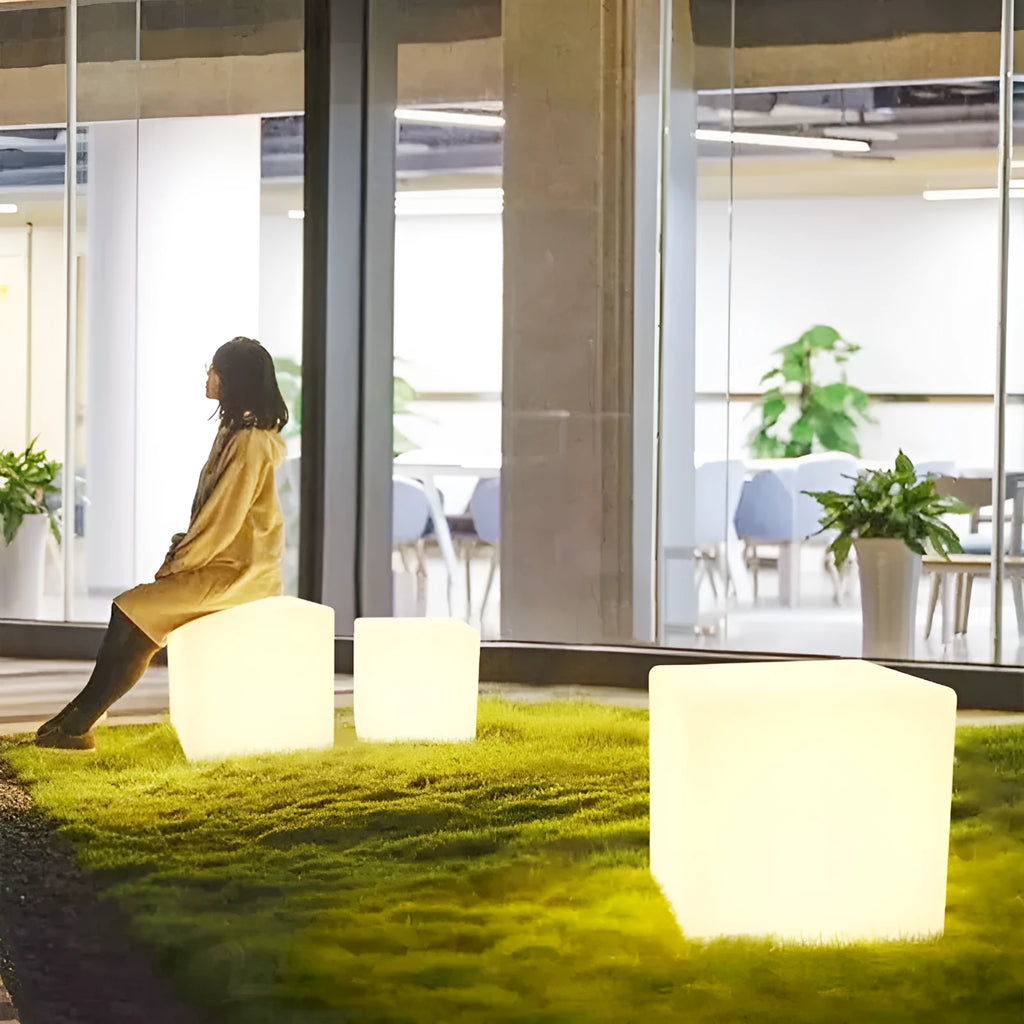 Square waterproof LED cube light stool in a modern style for outdoor garden use.