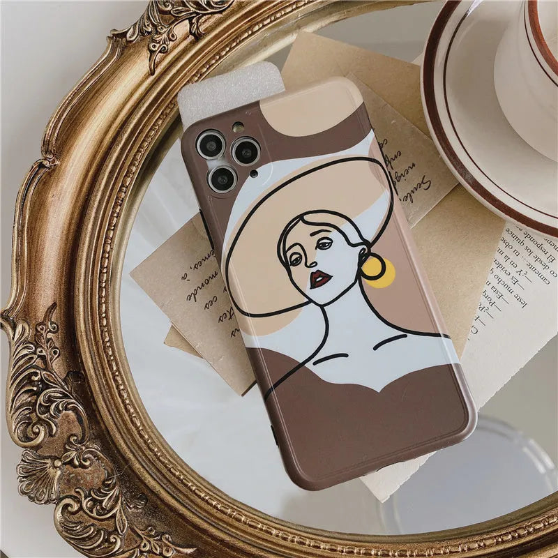 Orange yellow soft silicone iPhone case with cartoon line art graphic, shown fitted to an iPhone.