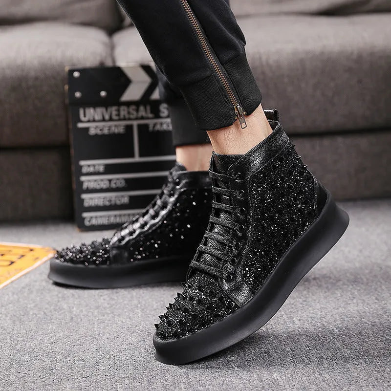 Men's black leather martin boots business dress shoes with rivets on a surface