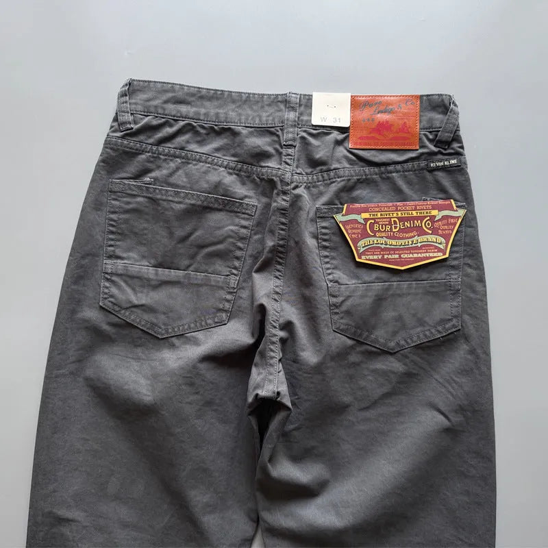 Men's straight-leg cotton casual trousers in grey, army green, and khaki colours on a mid-rise waist.