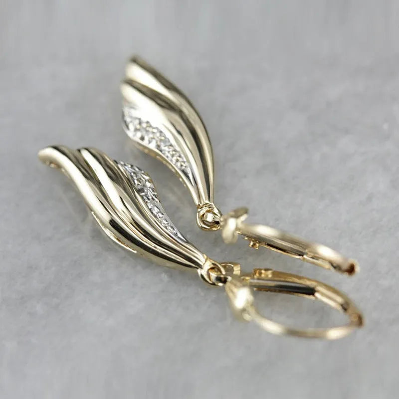 Heart shaped stud earrings in gold alloy with simple geometric design
